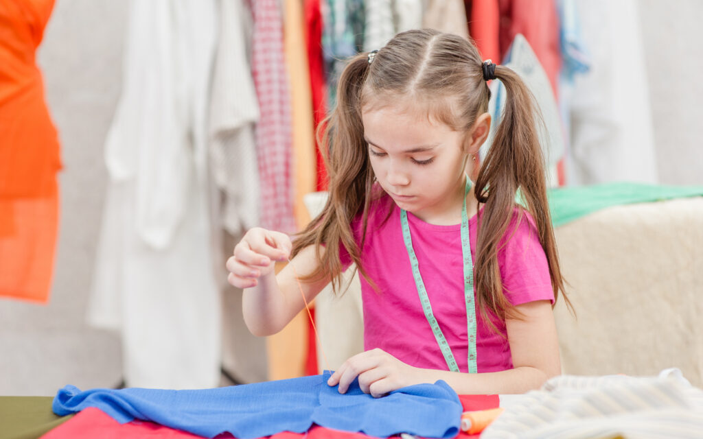 Girl sewing clothes.