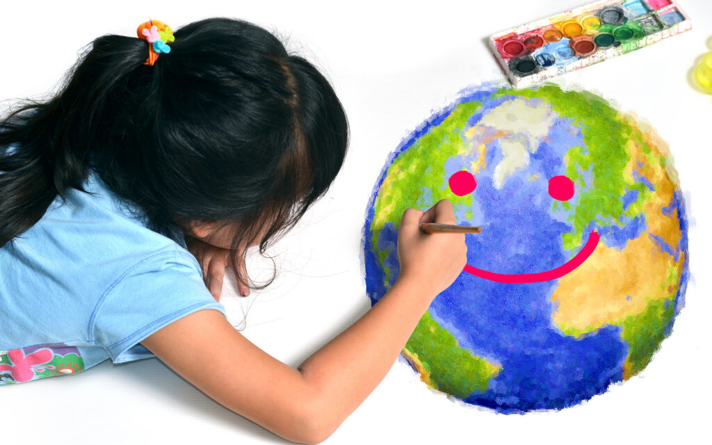 Girl painting the world with a smile face.