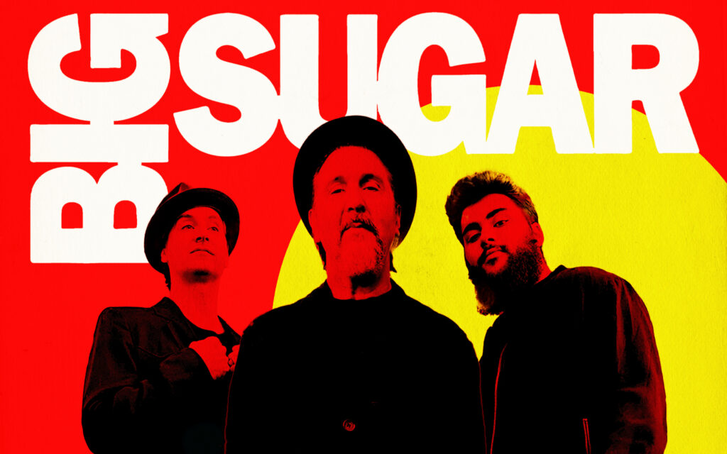 Big Sugar band with a red and yellow background.