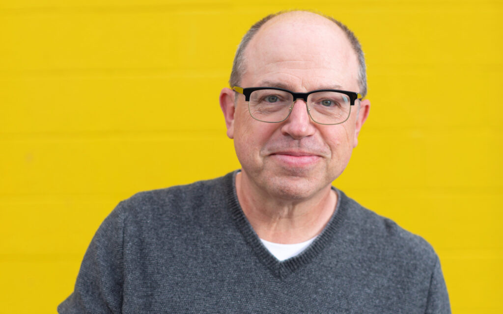 Brent Butt promo with yellow background.