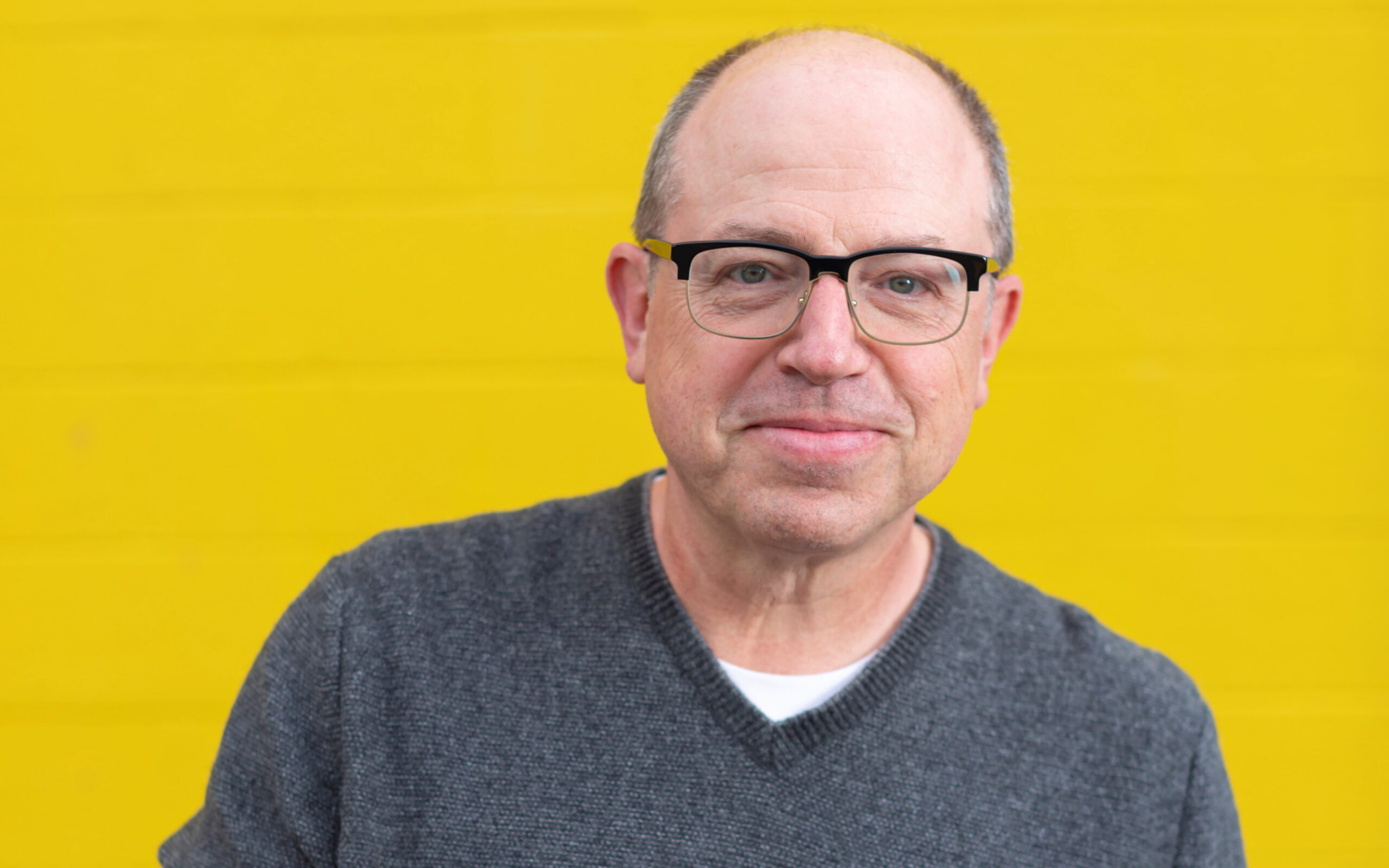 Brent Butt promo with yellow background.