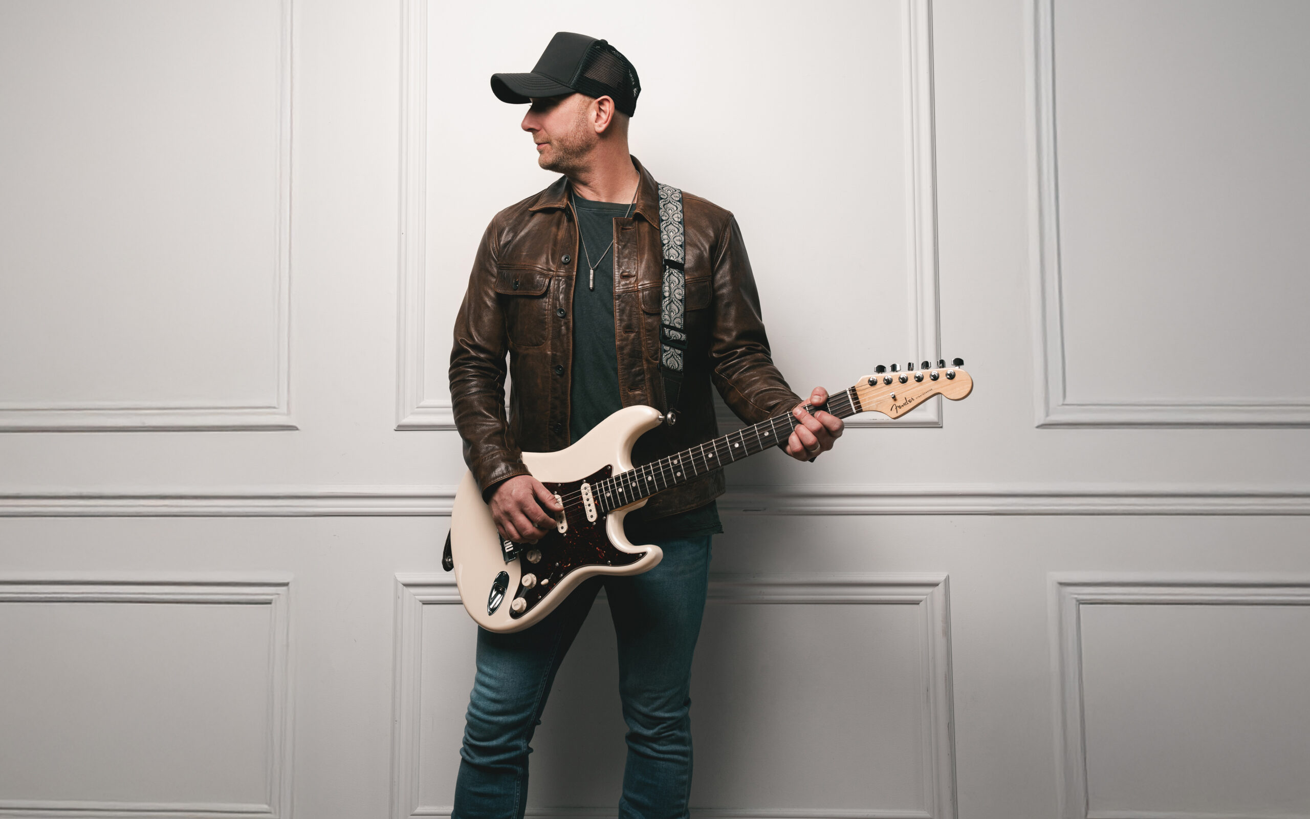 Tim Hicks playing a guitar.