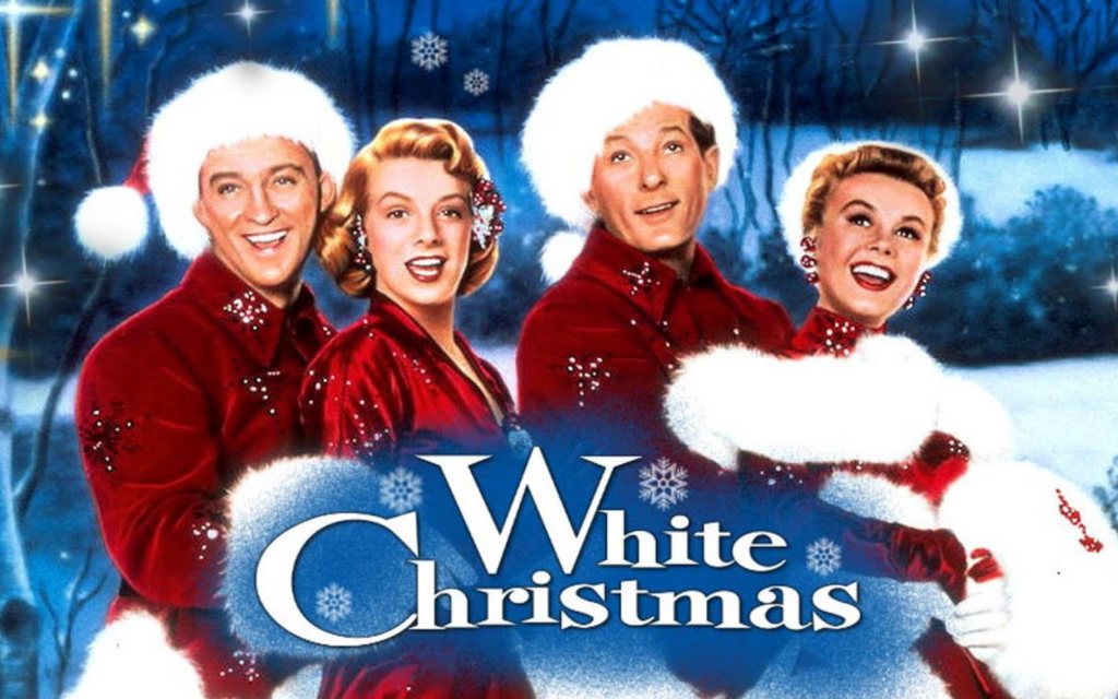 Four women wearing Santa Claus suits with a snowy blue background.